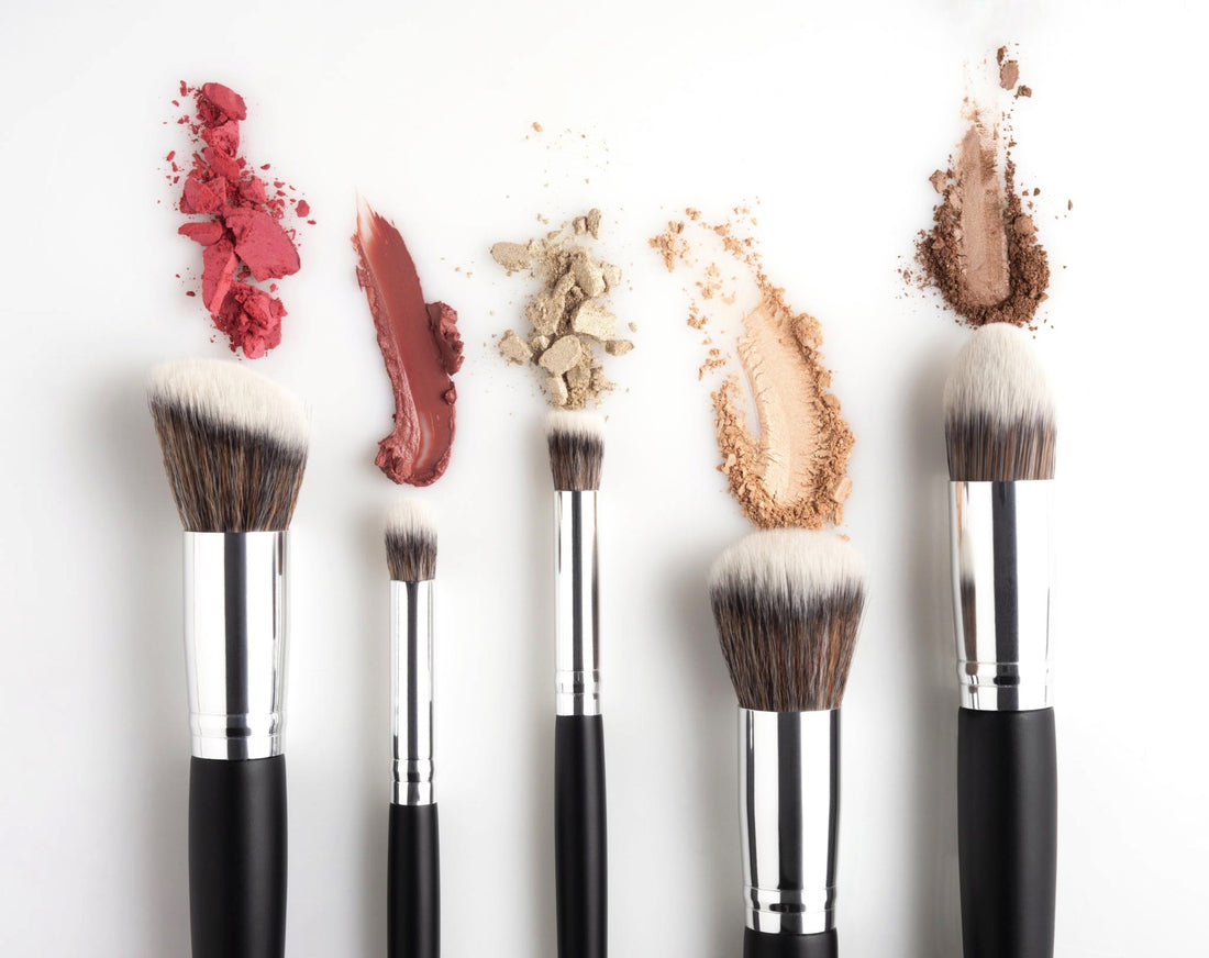 Insert a captivating image of makeup brushes and products arranged beautifully